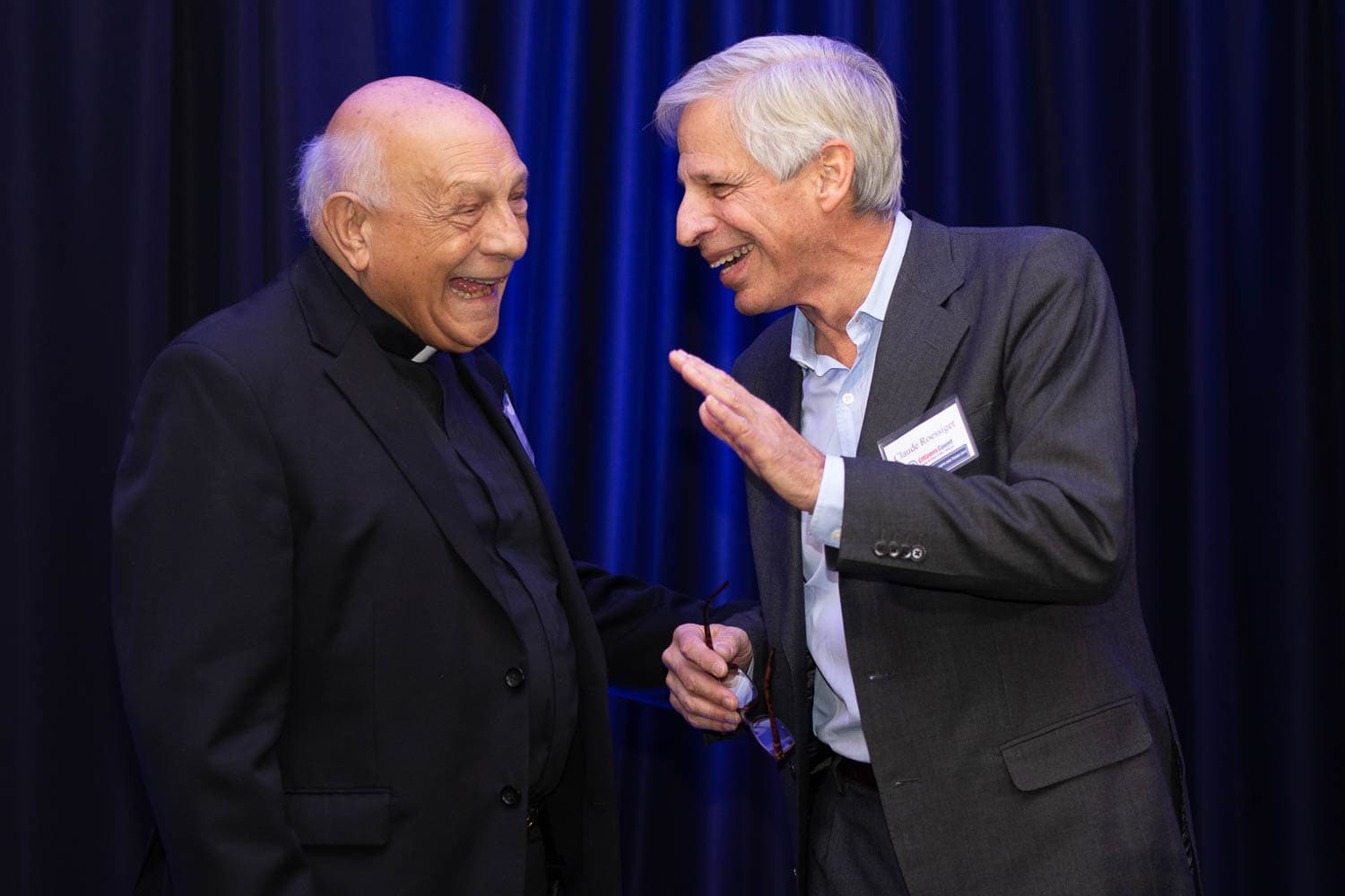 Guests sharing a candid conversation at an event