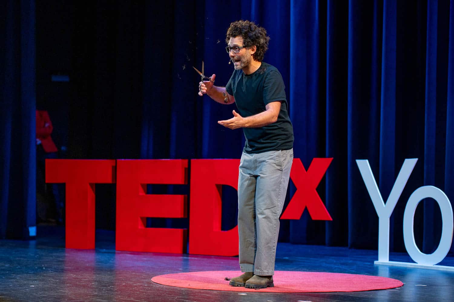 A keynote speaker engaging an audience from the stage